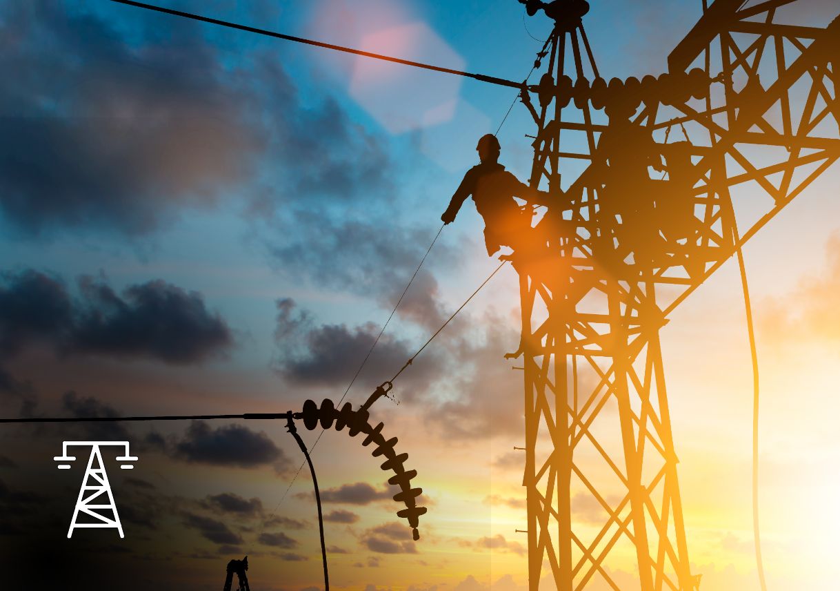 An electrical worker at the top of an electrical tower