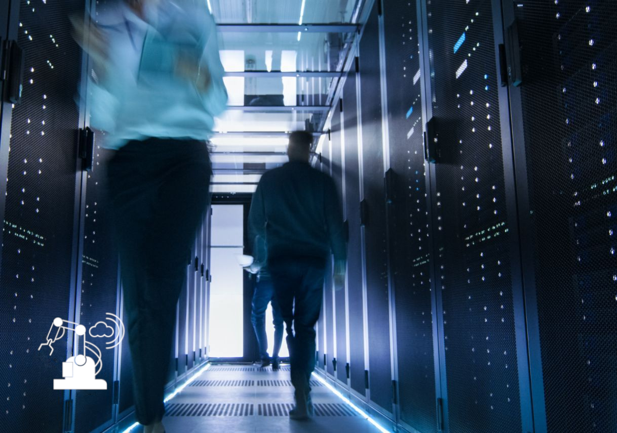 People walking next to towers of servers